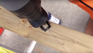 reciprocating saw cutting timber